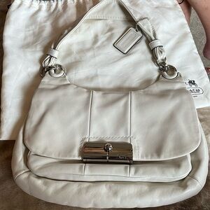 COACH brand new “Kristen” cream leather bag with drawstring duster